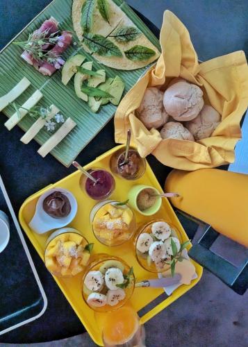 a table topped with a tray of food with appetizers at Fare Bambou in Gujan-Mestras