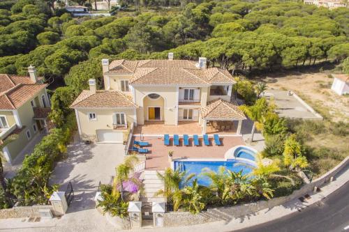 an aerial view of a house with a swimming pool at Villa Valentina by Algarve Holidays in Almancil
