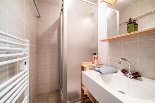 a bathroom with a sink and a shower at Appartement vue montagne - Chatel in Châtel