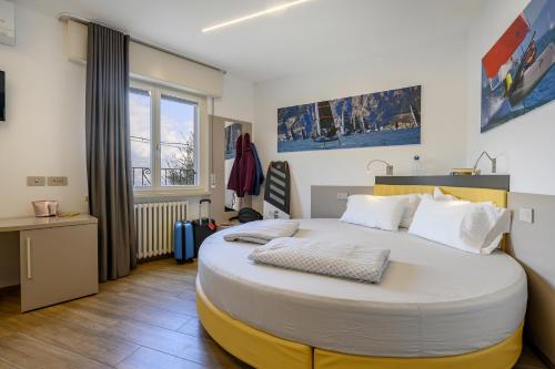 a bedroom with a large bed in a room at Hotel Pace in Brenzone sul Garda