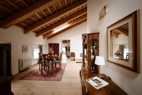 a living room with a table and a dining room at Villa Bido in Anguillara Veneta