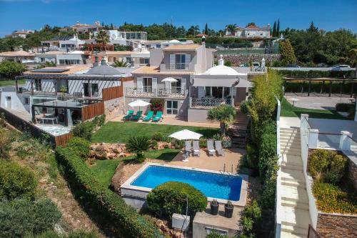 an aerial view of a house with a swimming pool at Villa Vista by Algarve Holidays in Valados