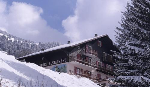 a building on top of a snow covered mountain at Le Roitelet in Châtel