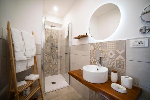 a bathroom with a sink and a shower at B&B MargAni Tropea in Tropea