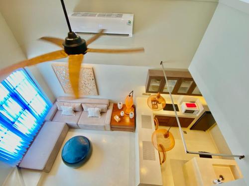 a view of a living room with a ceiling fan at Baliris Home Boutique Legian in Seminyak