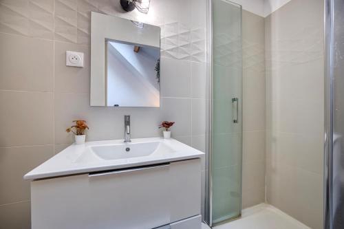 a white bathroom with a sink and a shower at COLIVING - Private Suite Bathroom - Toilet in Saint-Jean-de-Gonville