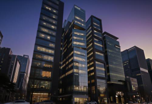 a group of tall buildings in a city at UH Suite The Seolleung in Seoul
