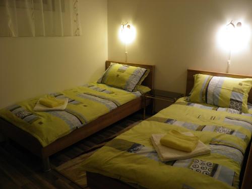 En eller flere senge i et værelse på Apartman Marko