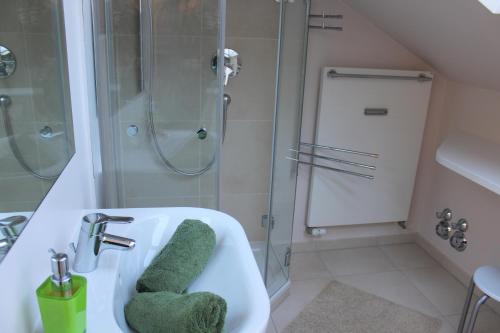 a bathroom with a sink and a shower at Ferienwohnung Rengstorf in Oberstdorf