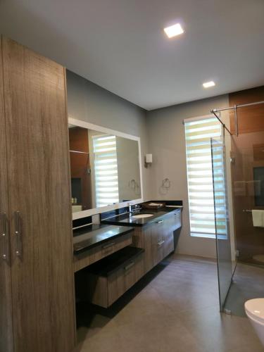 a bathroom with a sink and a mirror at One Hagdan Villas in Boracay