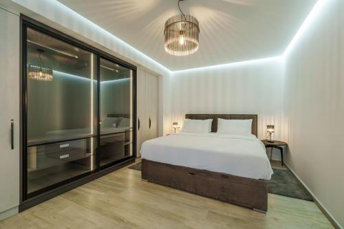 a bedroom with a bed and a large window at Apartments Barbara Kraljevica in Kraljevica