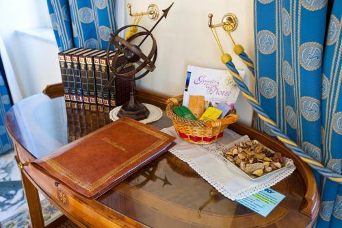a glass table with a tray of food on it at Villa Angelina in Massa Lubrense