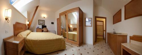 a bedroom with a large bed and a bathroom at Villa Angelina in Massa Lubrense