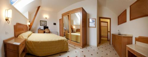 a bedroom with a large bed and a bathroom at Villa Angelina in Massa Lubrense