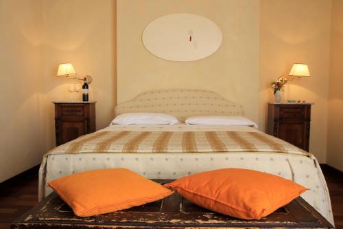 Ένα ή περισσότερα κρεβάτια σε δωμάτιο στο Hotel & Ristorante degli Angeli
