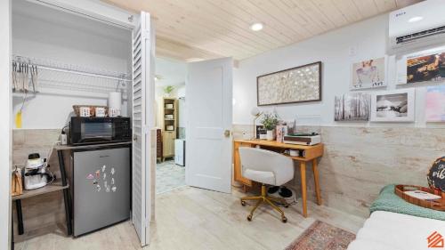 a room with a desk and a computer in it at Swiftie Suite Beach Getaway Studio in Santa Rosa Beach