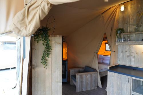 a room with a tent with a bed in it at F1 Group Stay Close to Track Parking Grumpy in Amblève