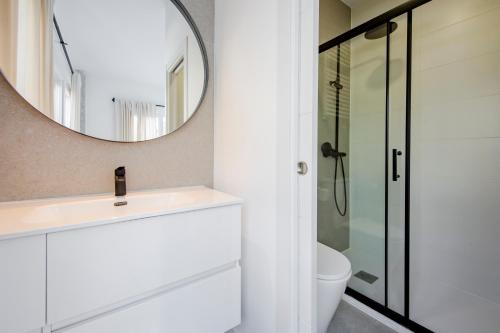 a bathroom with a sink and a mirror at Plata by Clabao in Madrid