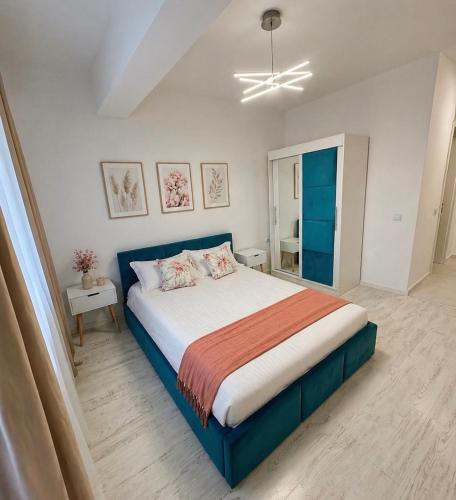 a bedroom with a large bed in a room at Noblesse residence - parking Militari residence Chiajna Dudu in Chiajna