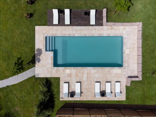 an overhead view of a house with a swimming pool at Le Domaine Du Clos in Tourmont