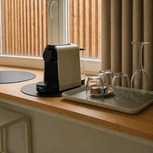 a toaster sitting on a counter next to a window at Le4bergheim Chambre d'hôtes in Bergheim
