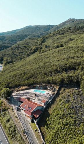 an aerial view of a house with a swimming pool at Casa do Capucho - Soajo, Gerês in Soajo