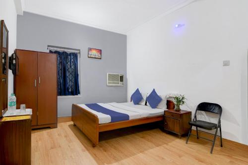 a bedroom with a bed and a chair in it at Brill Rooms Near City Centre Metro Station in Salt Lake City
