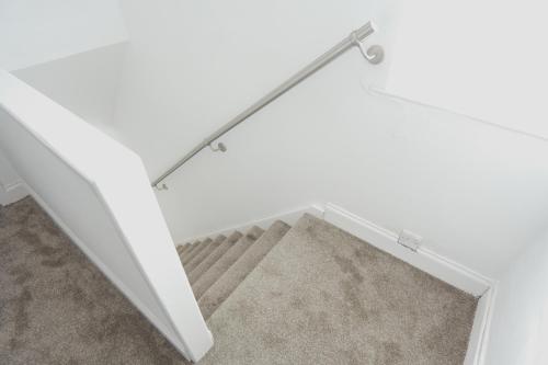 an overhead view of a stairway with a mirror at The Linwood Terrace in Eastwood