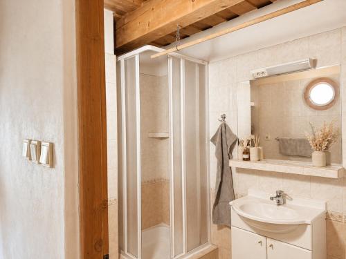 a bathroom with a shower and a sink at Penzión Liezky in Mýto pod Ďumbierom