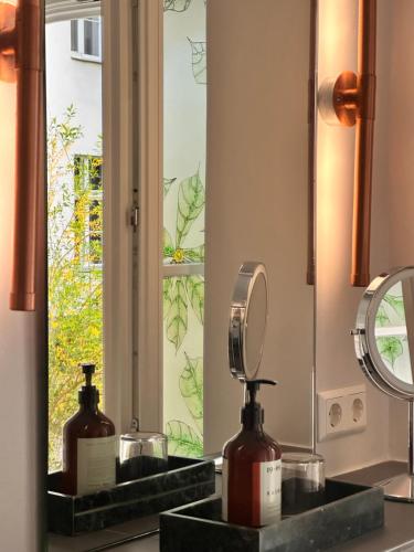 a bathroom with two sinks with a mirror at Wil7 Boutique Hotel in Berlin