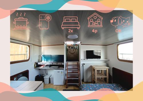 a caravan with neon signs on the side of it at Le logement du marinier in Eckwersheim