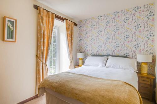 a bedroom with a bed and a window at 1 Bed in Llanerchymedd oc-wai212 in Llanerchymedd