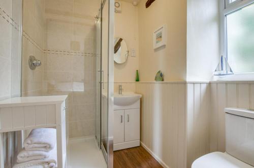 a bathroom with a shower and a sink at 1 Bed in Llanerchymedd oc-wai212 in Llanerchymedd
