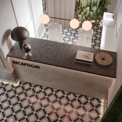 a counter in a room with a table and a counter top at Aureline Hill in Baku