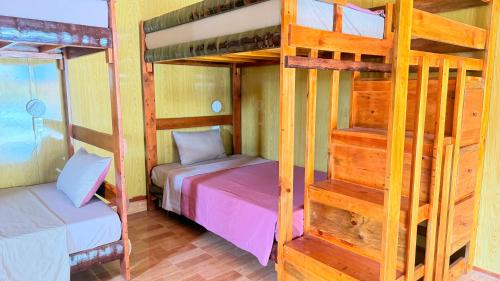 a bunk bed room with two bunk beds at Loop Tribe Hostel in Ha Giang