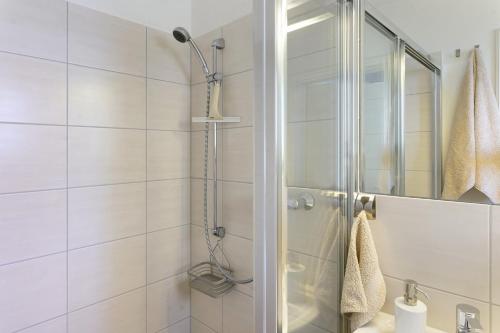 a bathroom with a shower and a sink at Belvedere-Remise in Weimar