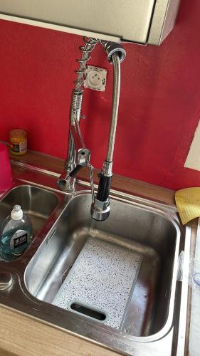 a kitchen sink with a faucet at Hibiscus holiday in Capesterre-Belle-Eau