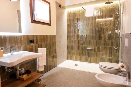 a bathroom with a shower and a sink and a toilet at ll Crinale Village in Colli del Tronto