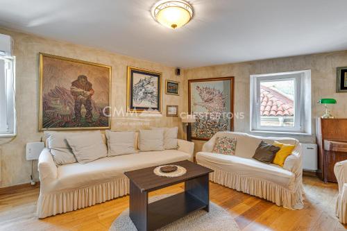 a living room with a couch and a table at Budva Old Town 3 bedroom Condo in Budva