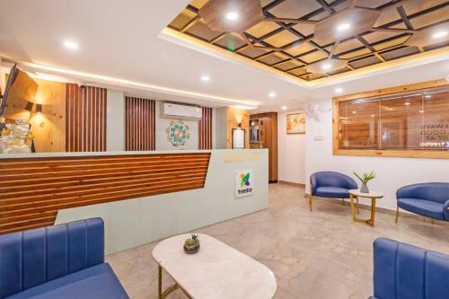 a waiting room at a hospital with blue chairs at Treebo Premium Paarth Grand with Pure Veg Restaurant in Haridwār