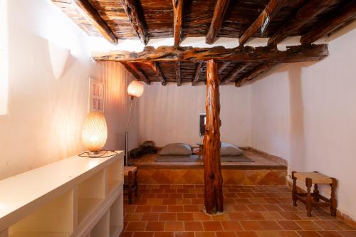a bedroom with a bed in a room at New! Villa Can Marsoch in Santa Eularia des Riu