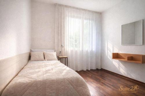 a bedroom with a large bed and a window at Suite 21 - Residence Contini in Falconara Marittima
