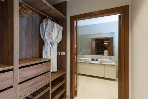a bathroom with two sinks and a mirror at Kotor Bay Villas by Huma in Dobrota