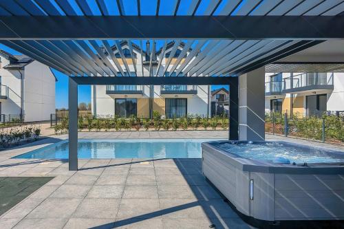Bałtycka Oaza - Apartament z Ogrodem i Parkingiem - Basen, Jacuzzi, Sauna by Noclegi Renters