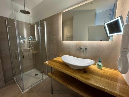 a bathroom with a sink and a shower at Villa Pippingsburg am Strand in Ahlbeck