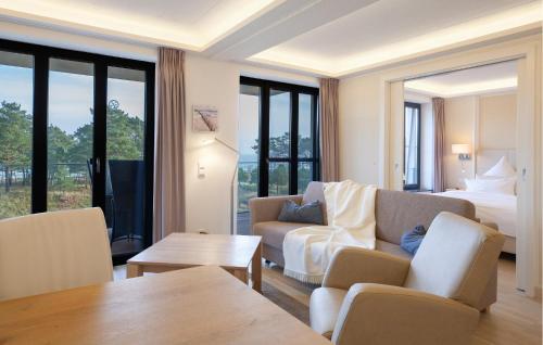 a living room with a couch and a bed at Prince in Binz