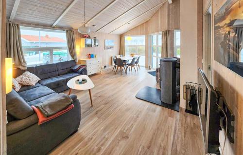 a living room with a couch and a fireplace at Friedrichskoog-Strandpark 1 in Friedrichskoog