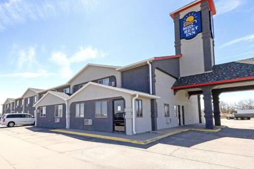 a building with a clock tower on top of it at Mid Rest Inn Lexington NE I-80 in Lexington