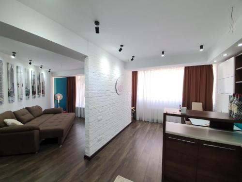 a living room with a couch and a table at Hotel Ismail in Chişinău