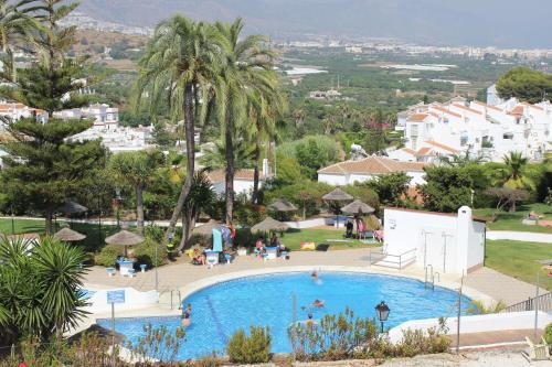 Výhled na bazén z ubytování Townhouse in Punta Lara nebo okolí